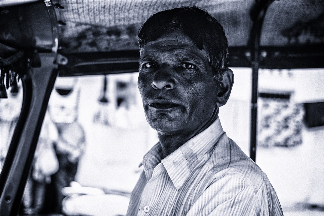 This rickshaw driver dropped me off at Gangaur Ghat. I asked him if I could take his picture for which he kindly obliged.